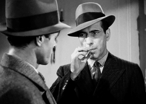 Bogart blowing smoke in Maltese Falcon