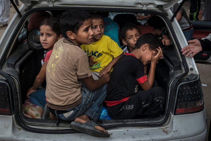letswakeupworld:

Palestinian children arrive at a shelter in Khan Younis after fleeing fighting.