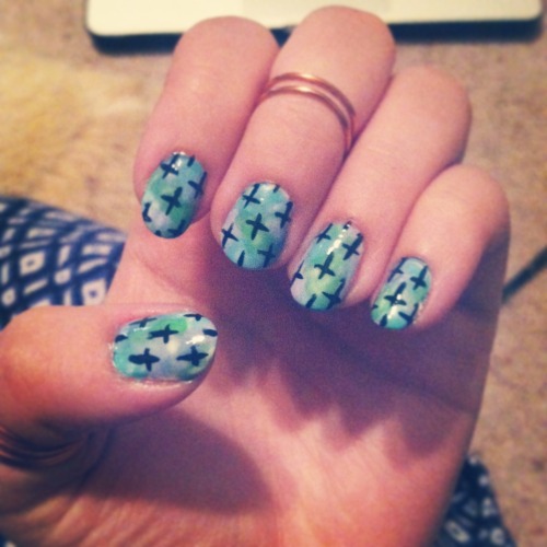 Pastel Watercolor nails with crosses on top.