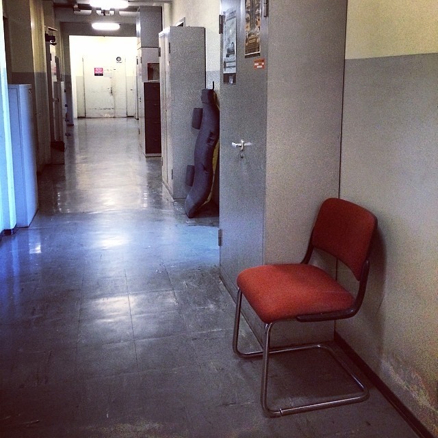 #lonelychairsatcern corridor chair and light from an open office #b15 #CERN