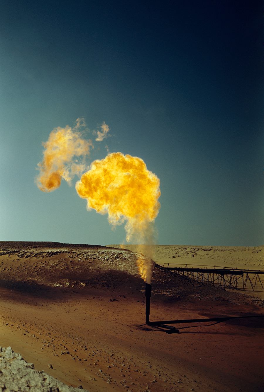A pipe emits poisonous gases in a flame produced by oil production, April 1948.Photograph by Maynard Owen Williams, National Geographic