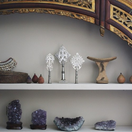 My #collection #detail #chinesebedframe #shelf #shelves #african #ethiopian #ethiopiancrosses #minerals #ethiopianprocessionalcross #africanheadrest #energy #power #crystals #healing #gypsy #boho #bohemian #decor #tribal #interiordecor #africankubaboxes #woodenspinningtops #geodes #purple #love #happy #altar #amethyst #cowryshells