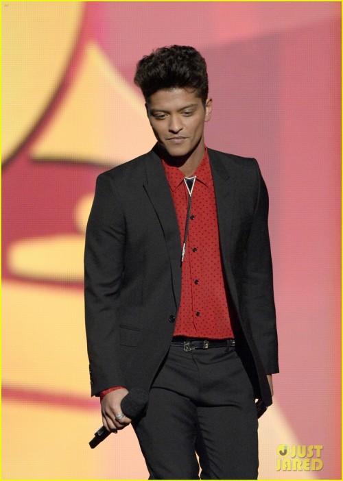 Musician Bruno Mars speaks onstage during the 56th GRAMMY Awards HQ