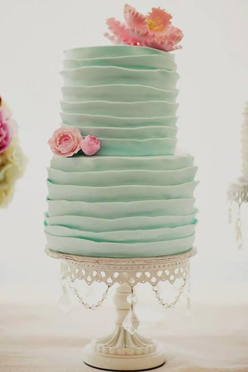 7 Wedding Cake Mistakes to Avoid:
Wedding Cake Mistakes #1: Limiting yourself. Shop (+ sample!) around.
Want a cheap date night with your soon-to-be spouse? Go wedding cake tasting! Many bakeries offer free wedding cake samples (be sure to call ahead) to engaged couples. Wedding cake tastes differ from place to place, so be sure to try before you buy. A sample will also give you an idea of which type of wedding cake, flavor, and filling you like and which ones you don’t.
Wedding Cake Mistakes #2: Assuming the cake is too expensive (or too complicated).
Love a wedding cake you saw in a magazine, on a blog, or on Pinterest, but it looks out of your price range? Don’t be so quick to dash your dream cake… just ask! A baker can give you a price estimate, let you know if the idea is feasible, or suggest ways to make it for less, if cost is the major deterrent. Make sure you find a baker you trust who has reputable work, a photo gallery of past designs, and a great review.
Wedding Cake Mistakes #3: Assuming the baker is a mind reader.
Be specific! Bring a photo of the wedding cake you have in mind to give to your baker. If you want a similar look with a few changes, be sure to write the ideas down on paper so the baker can have it on file. Since the baker has likely worked with many couples in the past, ask his or her advice or opinion on a particular design; he or she may have some great tips or ideas you haven’t thought of yet. And, while it’s unlikely your wedding cake will result in an epic fail, it’s best to be thorough when you want something specific on your cake. 
Wedding Cake Mistakes #4: Not ordering the cake YOU want.
Don’t be pressured to pick a wedding cake based on a traditional (or popular) flavor, color, trend, or style. Moreover, if you want a really simple cake, don’t be afraid to say so. Some of the prettiest cakes are the most simple – yet elegant – wedding cakes. And, finally, don’t pick a trending cake just because it’s popular: trends may change, but your photos? Those last forever.
Wedding Cake Mistakes #5: DIYing a wedding cake without a trial-run (or five).
Planning to make your own cake? It can be done! However, give yourself plenty of time and do a trial-run. Also, figure out where you’ll store the cake and how it will be delivered to your wedding.
Wedding Cake Mistakes #6: Not paying for delivery.
Throughout your wedding, there are lots of extra fees you’ll encounter. One of the fees you should never skimp on is the cake delivery charge. Transportation, delivery, and placement of a wedding cake is an art best left to the pros!
Wedding Cake Mistakes #7: Moving the cake once it is set.
Have your cake table ready before delivery. Once the cake is placed and set, it’s set. Don’t move it or you run the risk of ruining it.
What to Do If Something Goes Awry
At the end of the day, remember… it’s just a cake. Albeit a very gorgeous, expensive cake… but it’s just flour, sugar, and icing. Your cake may not look how you’ve dreamed, it may topple over, or it may never arrive. (If this happens, ask someone to grab you a grocery store cake. Yeah, it’s not the same thing by any stretch of the imagination, but it’s still cake. Guests want cake; they could care less about the presentation.) What’s important? Marrying your best friend at the end of the day. The rest? Just details.