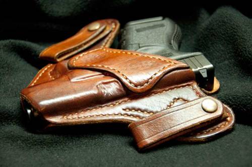 Hindgun in concealed carry holster