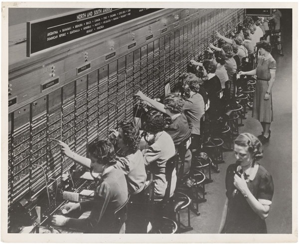 Long distance calls Photograph of Women Working at a Bell System Telephone Switchboard, 12/22/1943From the series: Women Working In Industry, 1940 - 1945; Records of the Women’s Bureau This photograph shows a telephone switchboard where overseas phone calls were handled during World War II. Many women patriotically joined the industrial workforce to work in shipyards or an aircraft factories, but many more worked in service or clerical jobs as secretaries, bank tellers, retail clerks, and telephone operators. via DocsTeach