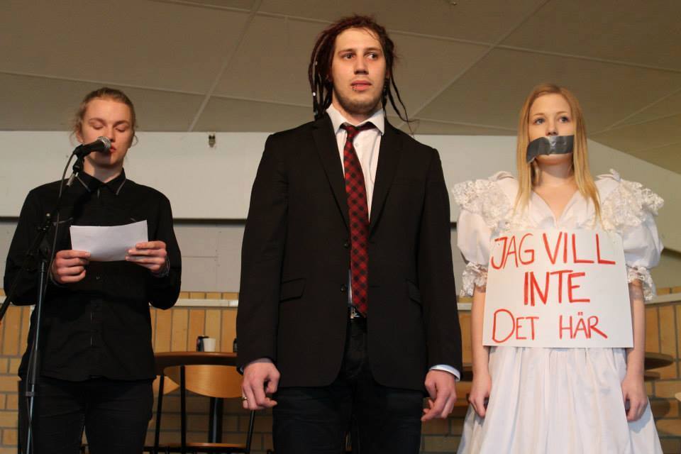 Youths displaying forced marriage on school, sign says “I don’t want this”, Sweden.
