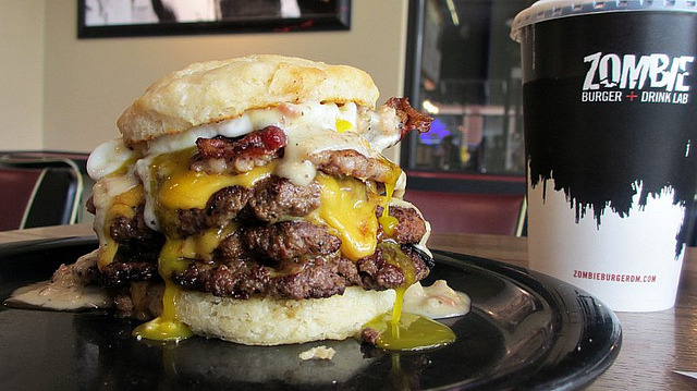 everybody-loves-to-eat:

The Dead And Breakfast at Zombie Burger in Des Moines Iowa by Tyrgyzistan on Flickr.Sausage patty,gravy,bacon,cheese and a biscuit as the bun. 