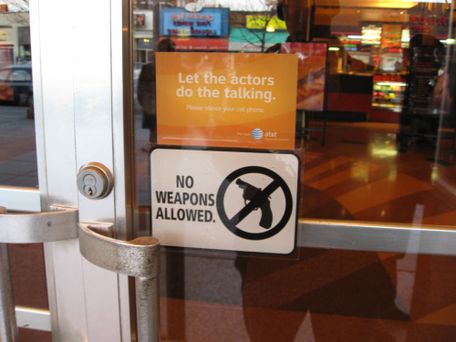 'No wepons allowed' sign in business window