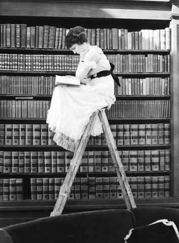 Woman reading on top of ladder, c.1920© Bettmann/CORBIS
[thanks for reminder,Alex;]