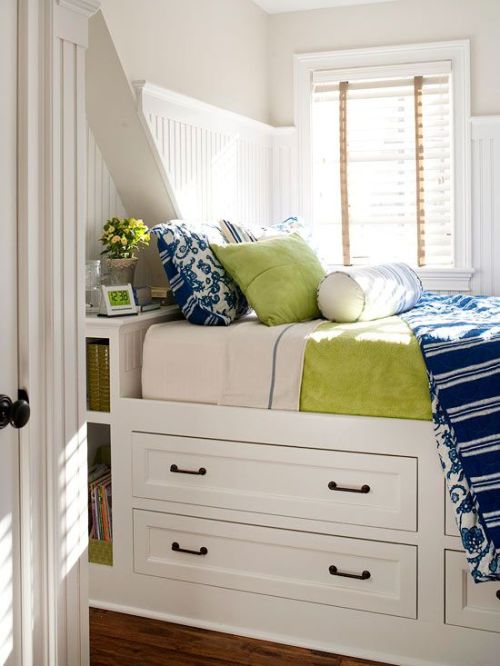 put a lovely day-bed over storage drawers (via BHG.com)
