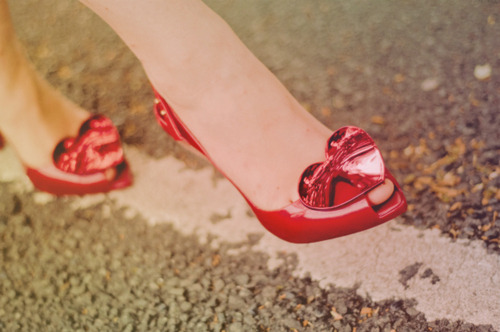 red shoes with heart shape bows