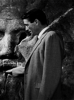 
In this famous “Mouth of Truth” scene, Gregory Peck ad-libbed the joke where he pretends his hand gets bitten off in the mouth of the stone carving. He borrowed the gag from Red Skelton. Before shooting Peck told the director that he was going to do the gag but did not tell Audrey Hepburn. When Peck pulled his arm out of the stone carving’s mouth with his hand pulled up his sleeve, Hepburn’s horror and surprise was genuine. She gave what she later recalled was “a good and proper scream,” and the scene was finished in one take.(x)
The &#8220;Mouth of Truth&#8221; or &#8220;Bocca delle Veritas&#8221; actually has a really cool story behind it. Men in the ancient world, when they believed their wives were being unfaithful, would drag them down to the mouth of truth, push their hand inside the mouth and ask them if they were having an affair. If they lied the Mouth of Truth would bite off their hand and expose their infidelity. The reason the hand no longer works is because one woman learned of her husband&#8217;s plan to bring her to the mouth of truth and ran to her lover begging him to take her away. Her lover calmed her down, told her he had a plan, and sent her back home. Sure enough, the woman&#8217;s husband came home that day yelling that she had been unfaithful and dragged her down to the mouth of truth. Just before he could push her hand inside it&#8217;s mouth the woman&#8217;s lover burst from the crowd, snatched her up and kissed her in front of everyone. Her husband angrily pulled her away, pushed her hand into the mouth of truth and demanded she tell him if she had ever kissed another man. The woman responded that aside from that madman just moments ago she had been faithful. Because she technically told the truth, the Mouth of Truth did not bite her hand but because it was so angry at having been thwarted, it refused to ever work again.
The End