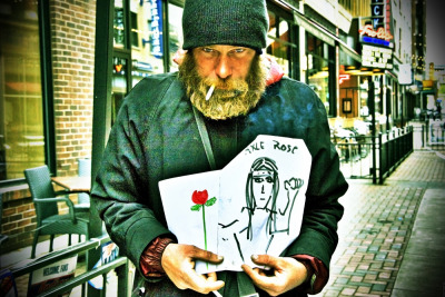 THORNS &#8212; A homeless man named Paul sells his hand-drawn artwork on E. 4th Street in downtown Cleveland on April 22, 2012. Paul said his deep faith in Jesus Christ keeps his spirits high. &#8220;It could be a lot worse,&#8221; Paul said of being homeless, &#8220;but it could be a lot better.&#8221; Photo by Brandon Blackwell @CapturedCLE 