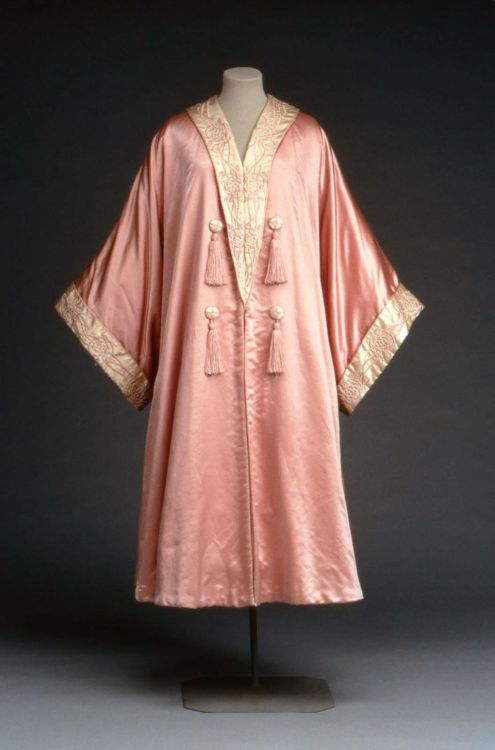 Evening coat by Liberty &amp; Co, 1900-25 London, the Museum of Fine Arts, Boston

Pink satin evening coat or wrap, cut in kimono style; collar and cuffs of white satin embroidered with pink silk in conventionalized floral design; lined with white satin. Front trimmed with white satin buttons wrapped with pink thread and pink tassels. Label: &#8220;Liberty and Co., London and Paris&#8221;

