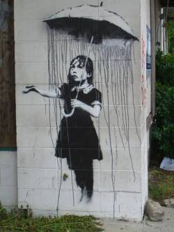whiskeypoweredmayhem:  poignantmoments:  asylum-art: Banksy, the street artist  This man is a LEGEND  That first one was here in New Orleans on the wall of the old drop in center which has been abandoned since Katrina. Not long ago some guys actually