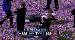 dailydot:  Baltimore Raven making a confetti angel after winning Super Bowl 