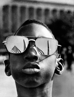 nerd&ndash;vana:  The top of the Washington Monument and part of a U.S. flag are reflected in the sunglasses of Austin Clinton Brown, 9, of Gainesville, Ga., as he poses at the Capitol where he joins others in the March on Washington, August 28, 1963.