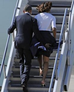 lust4life80:  President Obama saves Mrs. Obama from having a wardrobe malfunction. A true gentleman. 