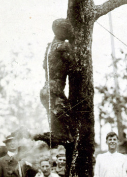 ratherbethestalker:  swankydee:  fucksurproblem:  The lynching of Jesse Washington.Washington was beaten with shovels and bricks,was castrated, and his ears were cut off. A tree supported the iron chain that lifted him above the fire. Jesse attempted