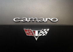 mycamaro67:  a beautiful detail in my 1967 Camaro (camaro logo and vflag logo). 