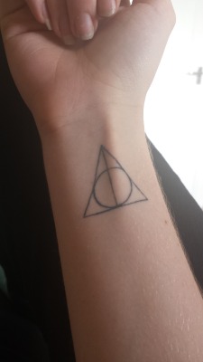 harrypotterconfessions:  This is my deathly hallows tattoo! (I’m not the same anon) I just wanted to show people how the Deathly Hallows looks on the wrist. I got it not just for Harry Potter but to remember my grandpa who gave me the books every time