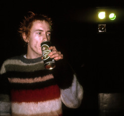 theunderestimator-2:  The Sex Pistols’ Johnny Rotten, photographed in 1976 by Ray Stevenson. “July 4th, 1976: when the Sex Pistols frontman went backstage at London’s  Roundhouse to pay his respects to the Ramones, who had just finished  playing