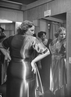 life:  Obesity in 1950s America — Caption from LIFE. “Embarrassed at shop because she wears a size 40, Dorothy tries on new dress. A friend encouragingly points out that dieting has reduced waistline by two sizes.” (Martha Holmes—Time &amp; Life