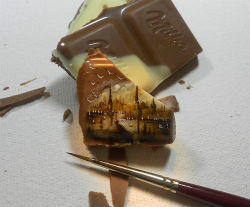 Tiny landscapes painted on food by Kasan Kale.