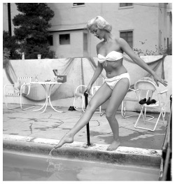 burleskateer:Misty Ayres          ..checks to see if the pool is warm enough for a dip!
