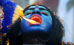 An Indian woman dressed as the Hindu goddess Kali appeared to breathe fire in a Ram Navami procession in Allahabad. The festival celebrates the birthday of Lord Ram.
