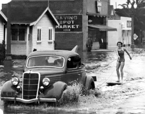vintageeveryday:  Mary Anne Hawkins surfing the flooded streets of Long Beach, California, ca. 1938. Read more here.