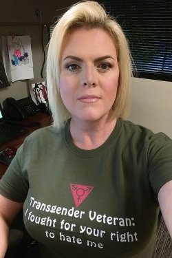 gaywrites:   Carla Lewis, a 44-year-old trans woman in Tennessee who served in the U.S. military, shared this photo on her Facebook recently. The photo says it all. (via the Huffington Post) [Image: A selfie of a woman with short blonde hair and a serious