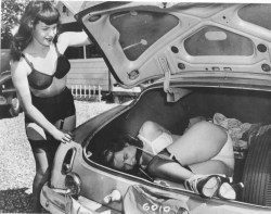 olgas-house-of-shame:  June King fits nicely in Bettie Page’s trunk. 