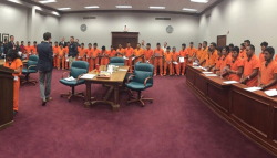 justsomeantifas: This secretly taken photo comes from a Texas courtroom during mass trial where dozens of immigrants are chained and tried all at once. Here’s what’s happening: · Lawyers Are Representing Dozens of People At Once (Literally) What