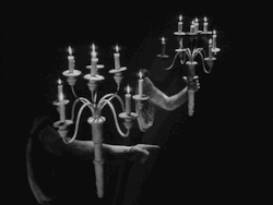 oorequiemoo:  oOrequiemOo: gif from the amazingly beautiful “La belle et la bête” Jean Cocteau’s masterpiece France, 1946 …in the beast’s castle,  invisible servants show you the way through night. 