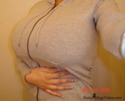 smushedbreasts:  http://smushedbreasts.tumblr.com  I love when she chooses implants so big that a baggy hoodie can&rsquo;t hide them.