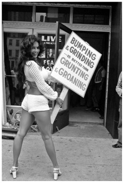 BUMPING &amp; GRINDING  is better than  GRUNTING &amp; GROANINGVintage 70′s-era press photo shows dancer Ronnie Bell protesting in front of NYC’s ‘Mayfair Theatre’.. A 2-act play entitled “Fear Of Love” was being presented, that involved