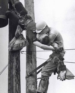 jonlittlebear:    The Kiss Of Life - A utility worker giving mouth-to-mouth to co-worker after he contacted a high voltage wire, 1967.  