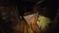 abandonedandurbex:  An ore cart and elevator lie abandoned far underground in the abandoned Evening Star Mine, Lane County, OR.  [2048x1152] Source: http://imgur.com/2Geynbm 