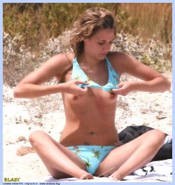 toplessbeachcelebs:  Laura ChiattiÂ sunbathing topless in Porto San Paolo (July 2007) 