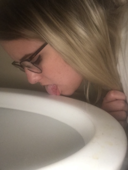 mostlyshy: 20 Year Old licking the toilet, showing off her big tits and hairy pussy in a public restroom and behaving like a pig with a taped nose and degrading body writing. Oh, and spit. 