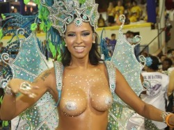 Topless woman in body paint at a Brazilian carnival.
