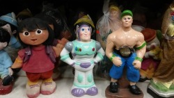 knockoffbootlegs:  a few piggy banks from a wholesale party supplies store near me. dora, buzz lightyear to the rescue, and john cena  I only see two