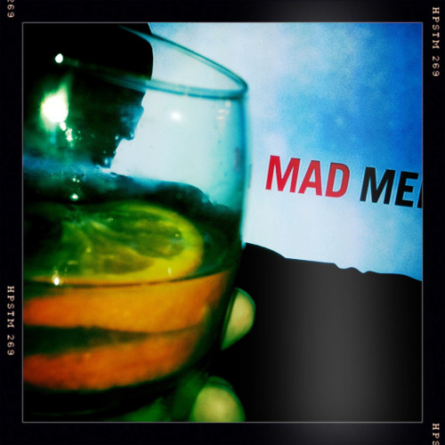 Mixed drink in front of 'Mad Men' logo
