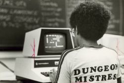 sexartandpolitics:  wildunicornherd:   Description, from the Wisconsin Historical Society: “View from behind of a young woman wearing a t-shirt with the title Dungeon Mistress printed on the back while she plays an adventure game on a computer. In the