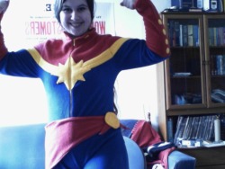 kellysue:  missjoat:  It happened. I made a Captain Marvel onesie. The entire thing is made from fleece fabric, even the button details and broach. The sash is removable and velcros on. It has thumb holes and felt soles on the bottom of the boots for