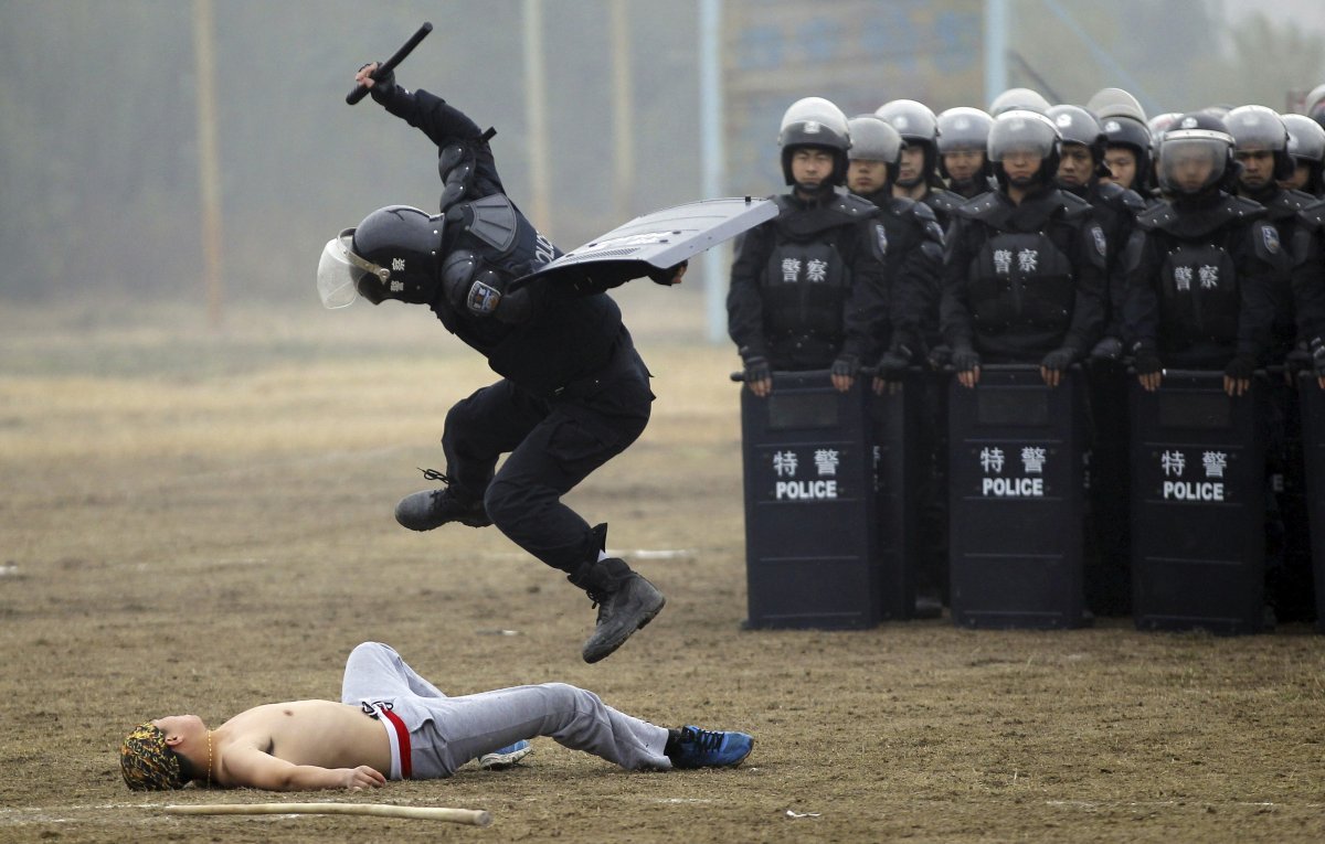 the-anarchic-astronaut: A Chinese riot police officer gives a demonstration 
