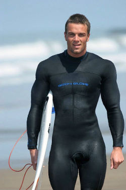 randy9bis:  sirjocktrainer:  Last year he surfed in just his board shorts but just as summer had started his Owner got him a surf suit. He was [not ?] sure about it at first but now, he can’t image not wearing it to hit the waves.  Sexy muscular boi