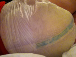 paperpotter:  This is little Smartieâ€™s last nappy.Â  A Tena Slip Maxi with three stuffers secured with duct tape.Â  She had to wear it to the airport to see me off :).Â  Unfortunately for her it made her walk a bit funny :D.Â  It also poked out of the